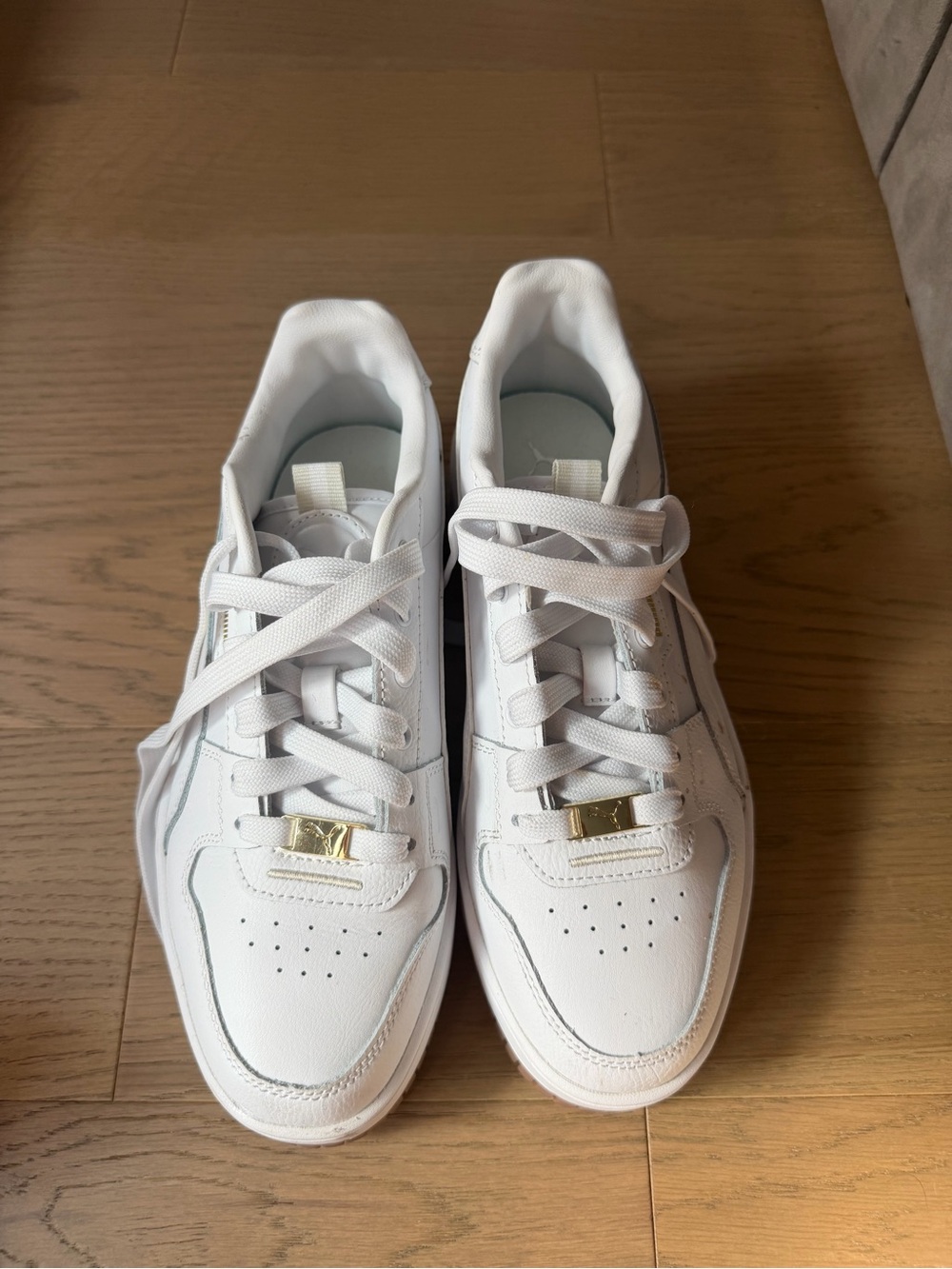 Puma Women's White Leather Low-Top Sneakers with Gold Accent